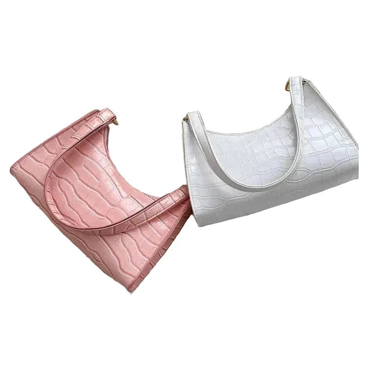 Sac de shopping élégant et raffiné pour femme : style rétro décontracté, porté épaule, en cuir uni.