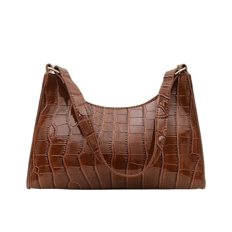Sac de shopping élégant et raffiné pour femme : style rétro décontracté, porté épaule, en cuir uni.