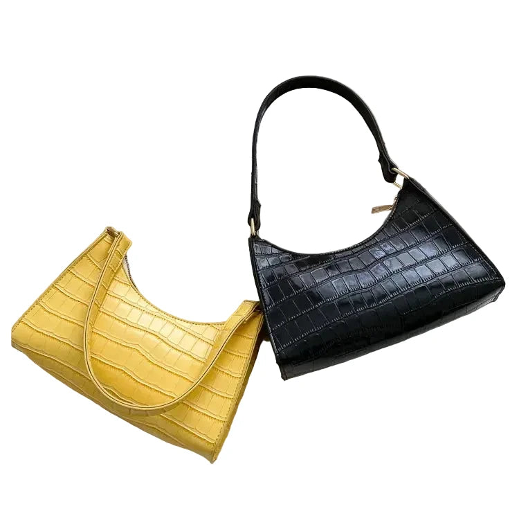 Sac de shopping élégant et raffiné pour femme : style rétro décontracté, porté épaule, en cuir uni.