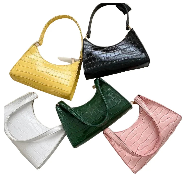 Sac de shopping élégant et raffiné pour femme : style rétro décontracté, porté épaule, en cuir uni.
